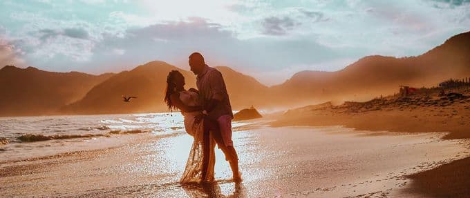 a couple having a beach romance